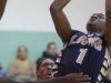 Leadership Academy senior guard Tyriek Snow shooting over East High's Brian Alexander earlier this season.