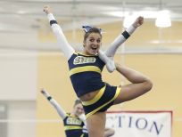 Spencerport lifts Taylor Pohleven in Division 1-Large competition.
