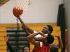 Early College's Tajmin Holt drives against Northstar's Trey Roberts.