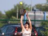 Pittsford Mendon’s Sara Lyons catches a flyout in center field.