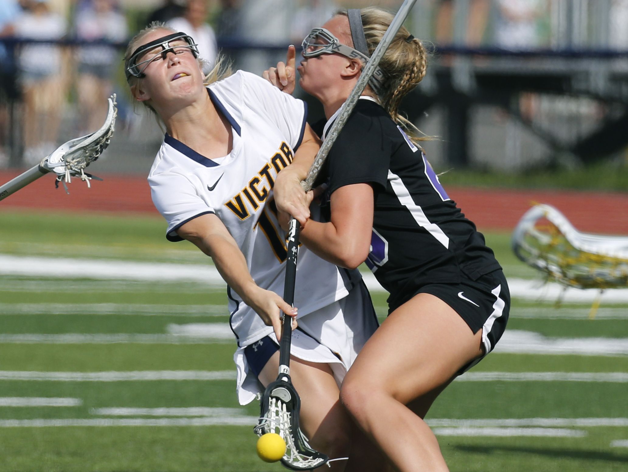 Victor's Kaci Messier collides with Hamburg's Addy Wright in the first half at Pittsford Sutherland High School.