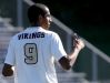 Adrian Padilla give a thumbs up to his coach Mark Hurley during the Pittsford Mendon soccer team's first game of the season against Aquinas. Padilla was chosen to wear the No. 9 Jersey of Honor this season.