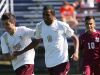 Adrian Padilla (9) gets a pat on the back from teammate Karson Bolanos after Padilla scored a goal during Pittsford Mendon's season-opening win over Aquinas.