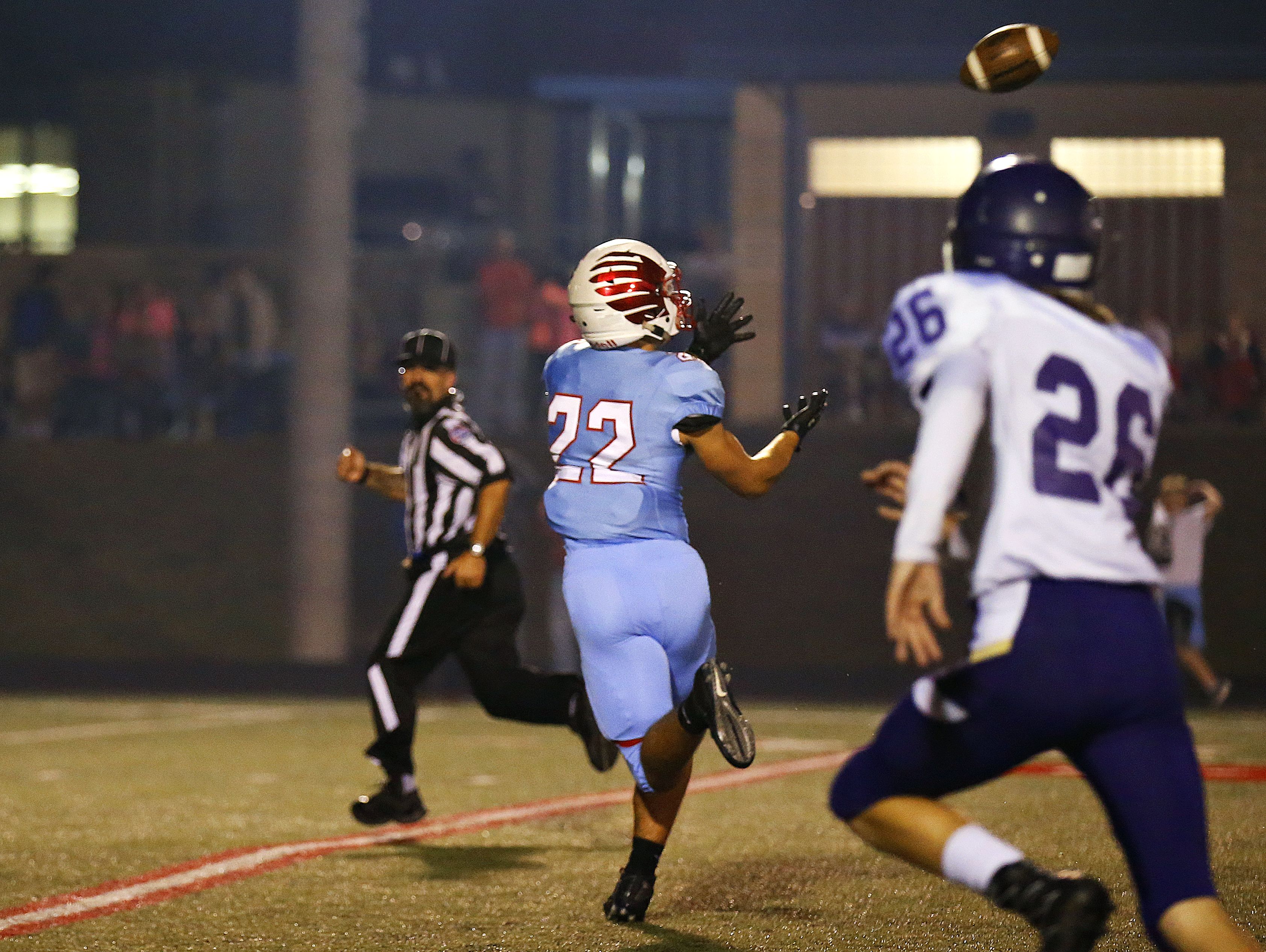 Glendale High School wide receiver Luke Montgomery (22) catches a long touchdown pass by quarterback Alex Houston (not pictured) during first quarter action of the game between Glendale High School and Camdenton High School at Lowe Stadium in Springfield, Mo. on Oct. 14, 2016. The Glendale Falcons won the game 63-35.