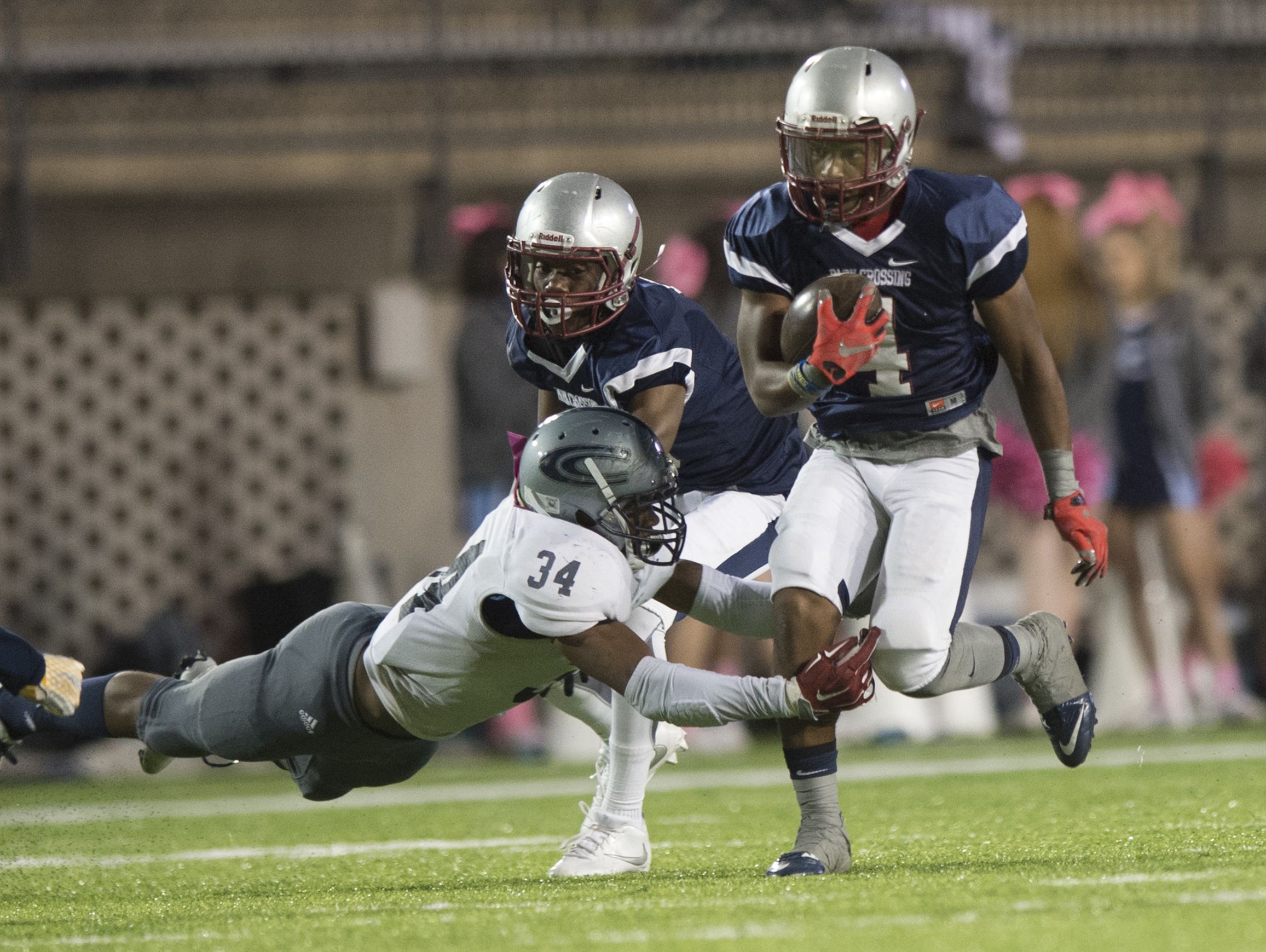 Park Crossing's Nicholas Jones (4) runs downfield as Clay-Chalkville's Derrick Beam attempts to tackle him during the football game on Friday, Oct. 21, 2016, at Cramton Bowl in Montgomery, Ala.