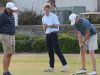 Brian Richards (center) and RJ Phillips (right) helped the Gulf Breeze High boys golf team to a strong start in Tuesday's first round of the Class 2A State Tournament.