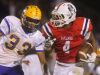 Oakland's Lazarius Patteron (4) runs the ball as Smyrna's Tevin Shipp (33) moves in for a tackle, on Friday, Oct. 28, 2016, at Oakland.