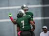 Cass Tech's (9) Donovan Peoples-Jones and (7) Rodney Hall celebrate a touchdown during Cass Tech's 35-7 win over Dearborn Fordson Saturday in Detroit.