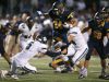 Victor running back Mitchell Spindler (24) leaps over the Pittsford's Frankie Imburgia (5).
