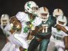 Fort Myers High School’s Darrian Felix scores a touchdown against Dunbar during first quarter play Friday at Dunbar High School in Fort Myers.
