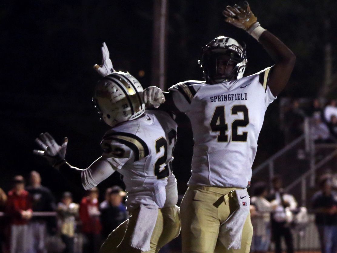 Springfield's Dayron Johnson and Alan Gardner celebrate a touchdown during their playoff game at Lipscomb Academy Friday November 4, 2016.