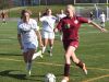 Arlington's Alexa Peruffo, right, takes the ball down the field as Monroe-Woodbury's Sydney Harwood, left, defends during Saturday's Class AA regional final.