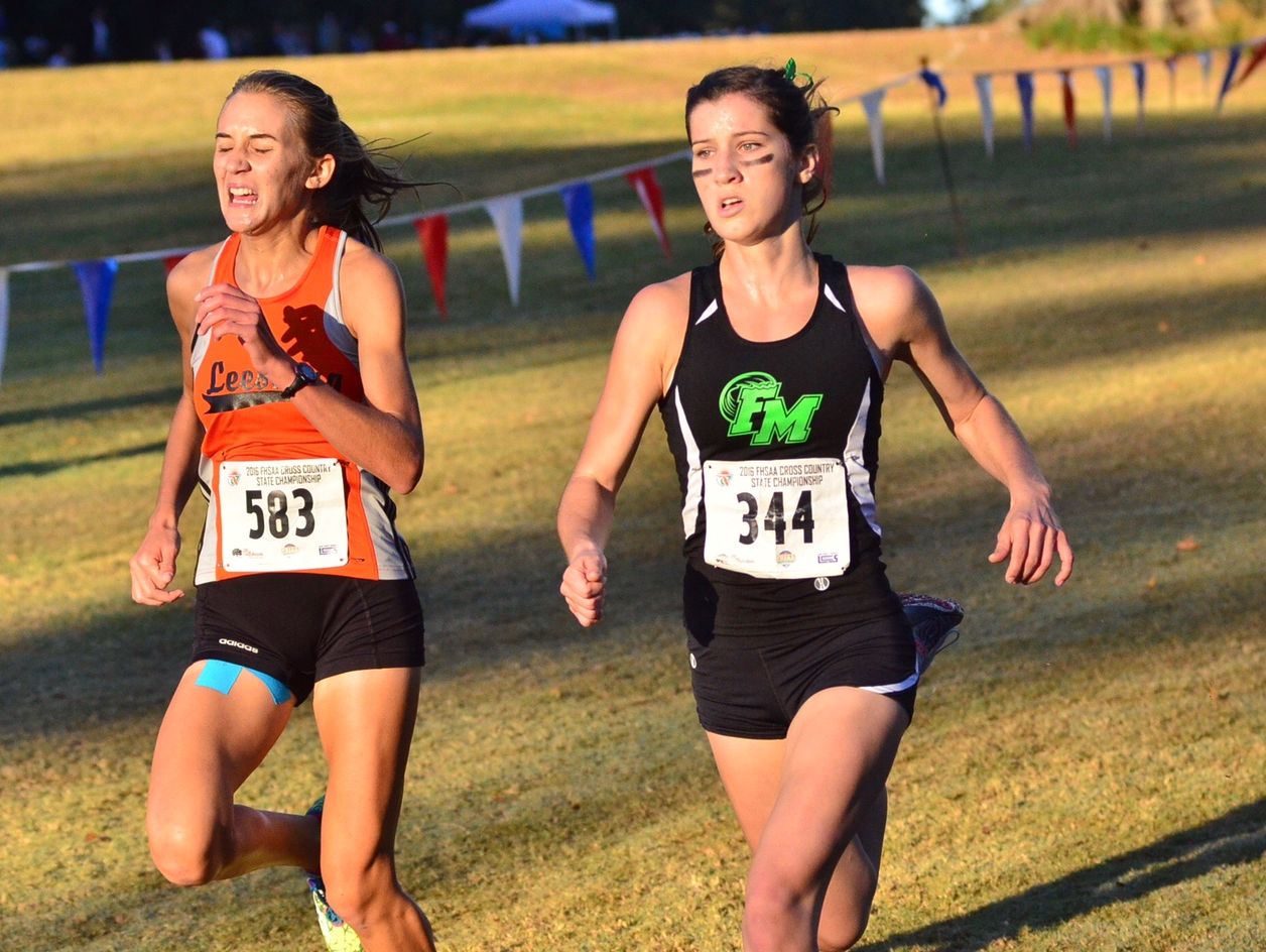 Fort Myers' Krissy Gear, right, run the course at the Class 3A state cross country meet Saturday, Nov. 5, in Tallahassee.