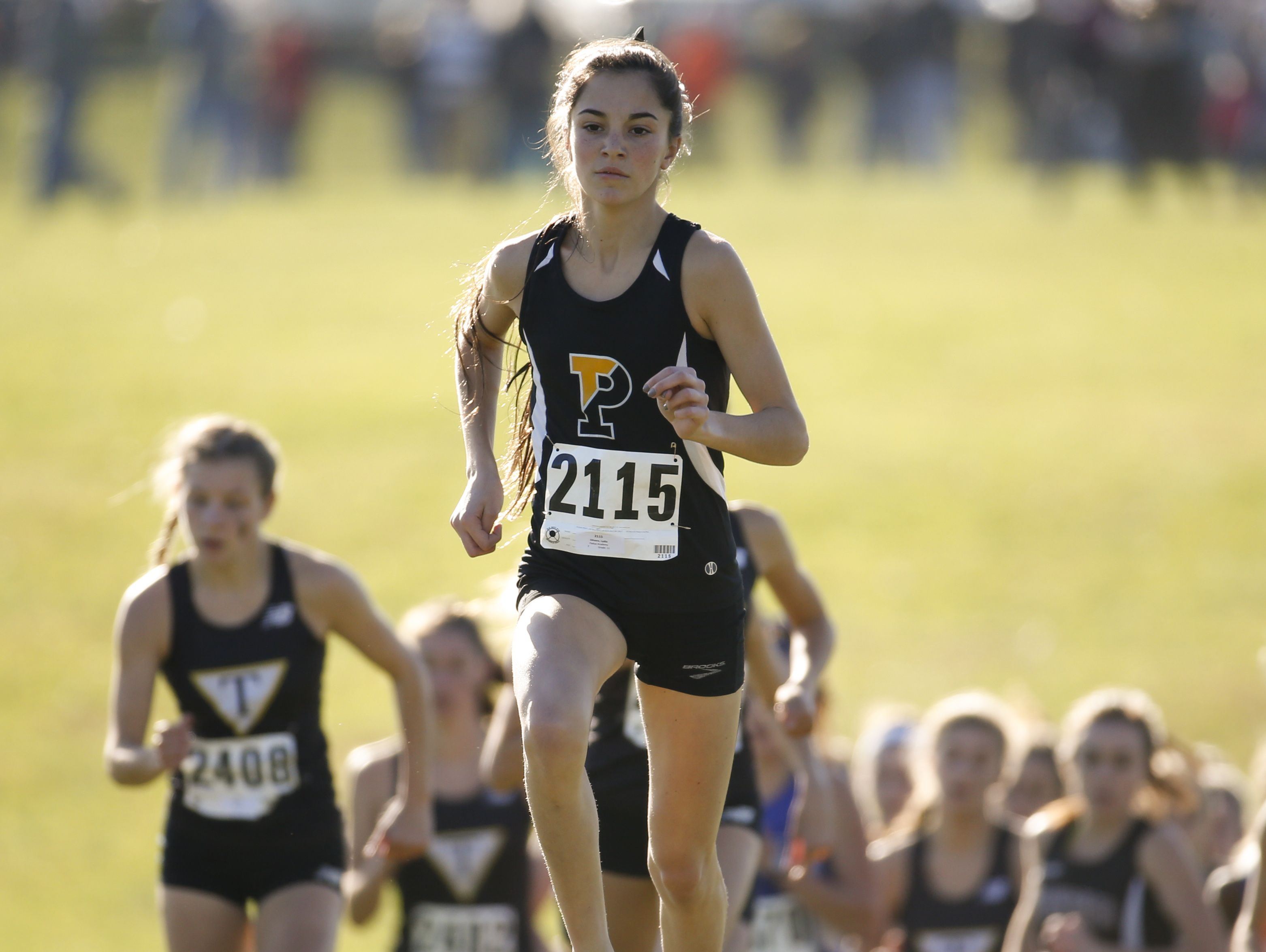 Eventual winner Lydia Olivere of Padua distances herself from the field early during the New Castle County cross country championships Saturday at Winterthur.