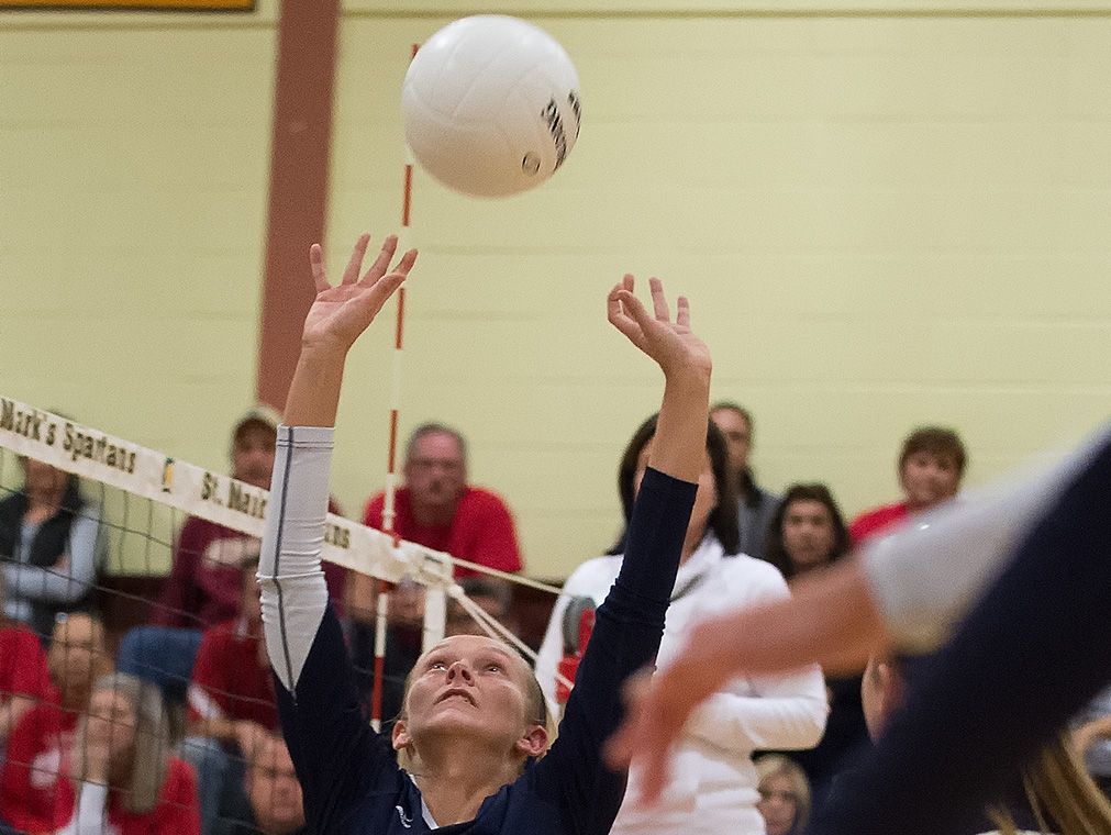 Delaware Military Academy's Sydney Fulton (7) sets the ball for a spike attempt in the second round game of the DIAA State Volleyball Tournament against Conrad.