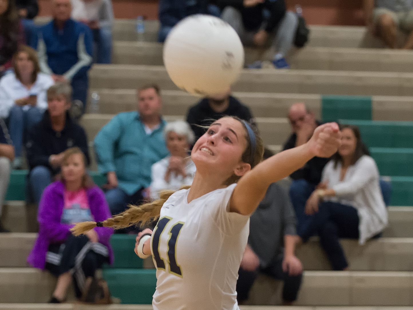 Delaware Military Academy's Kirsten Longueira (11) dives for the ball in the second round game of the DIAA State Volleyball Tournament against Conrad.