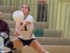Delaware Military Academy's Kirsten Longueira (11) returns a spike in the second round game of the DIAA State Volleyball Tournament against Conrad.
