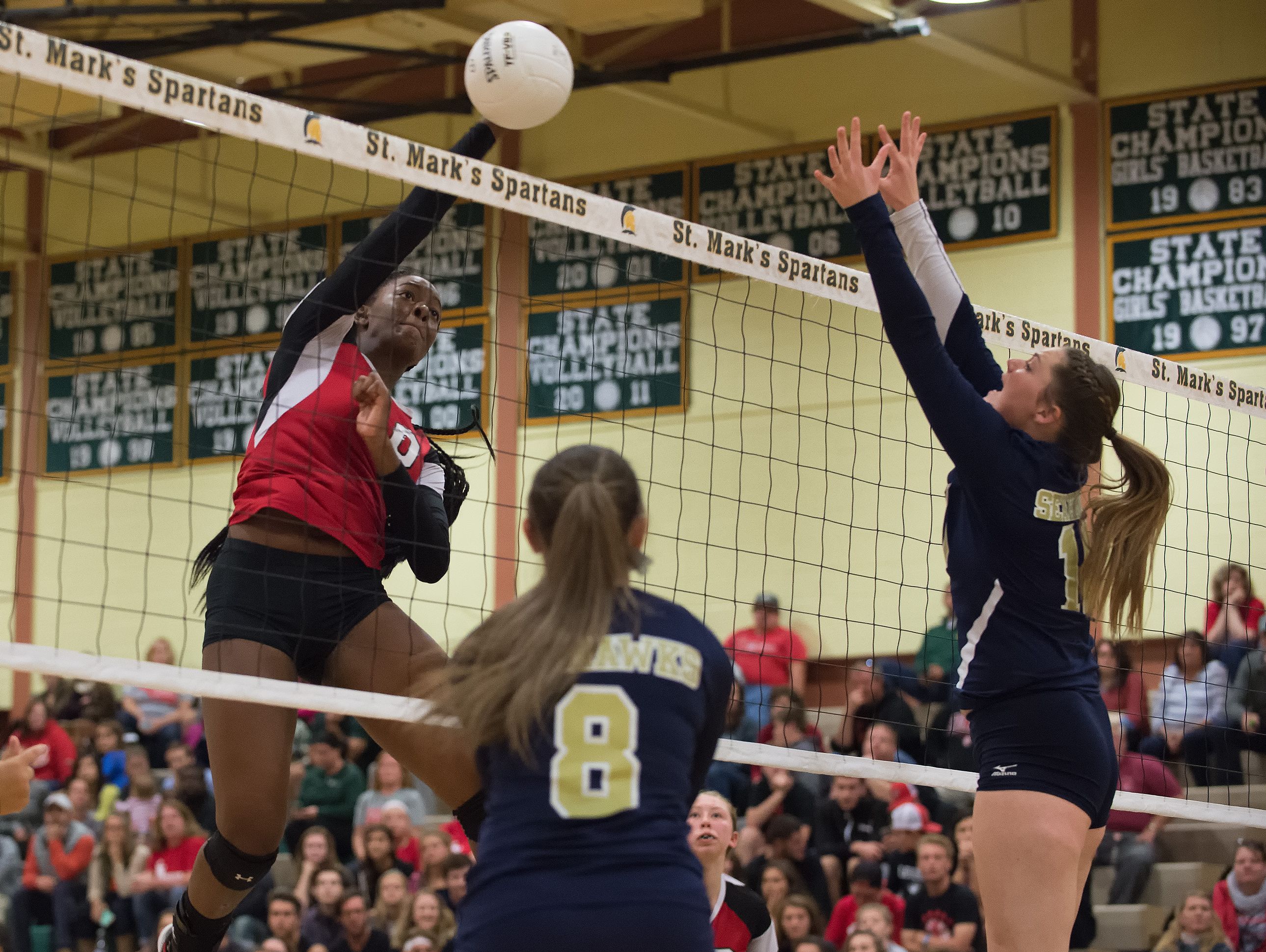 Conrad's Amiya Rattley (10) with a spike in the second round game of the DIAA State Volleyball Tournament against Delaware Military Academy.