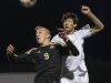 Fort Collins High School junior Derrick Eberling (9) heads a ball in the quarterfinal round against Denver East High School Saturday at All-City Stadium. Fort Collins lost 2-1.