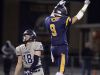 Victor's Andrew Russell (9) celebrates after stopping Pittsford's Colby Barker on fourth down.