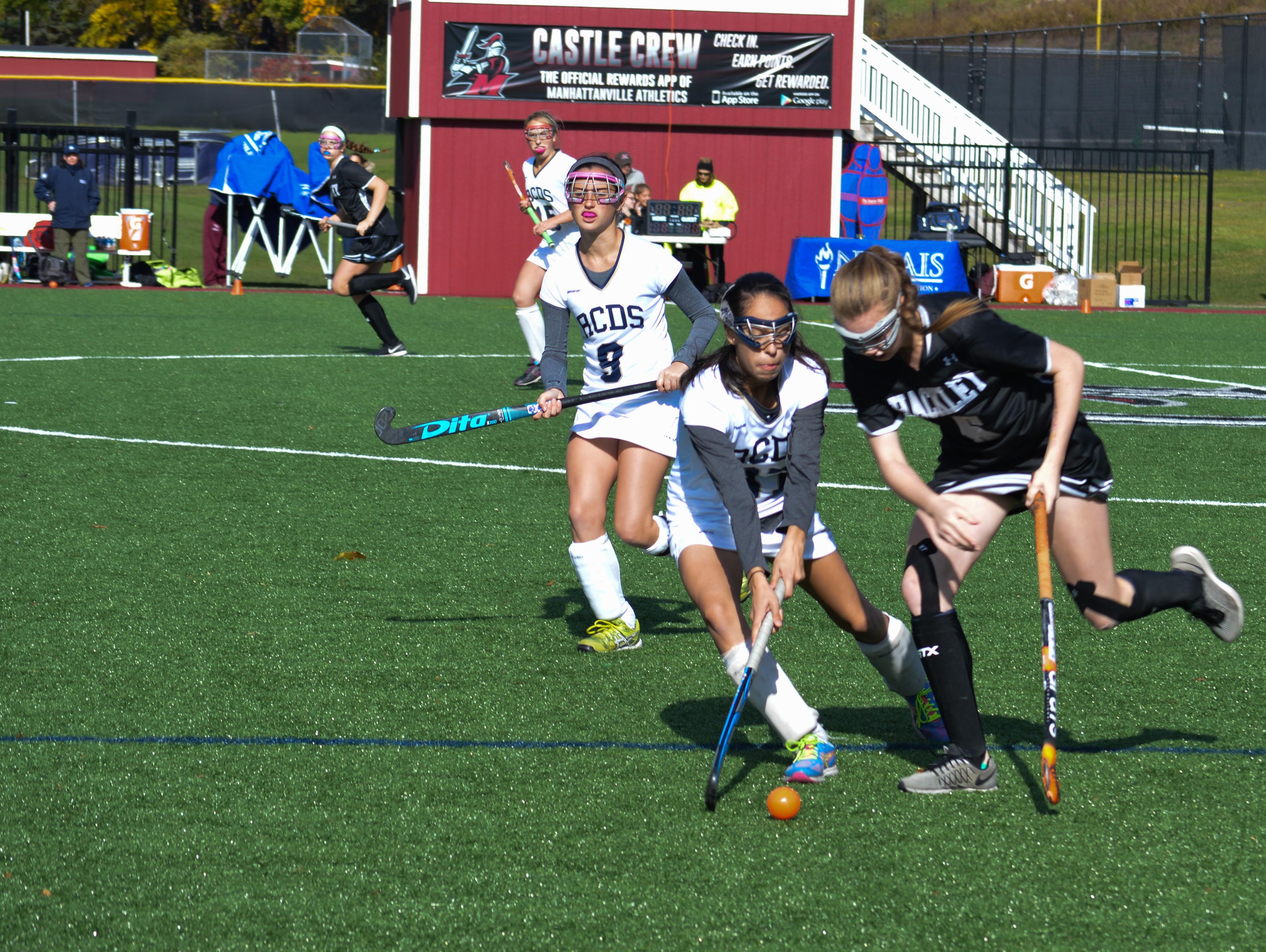 Hackley School's Karina Bridger defends against Rye Country Day's Olivia Weaver the 2016 NYSAIS field hockey final at Manhattanville College on Nov. 6, 2016.