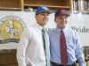 Athletes Matthew Estrada (University of West Florida), left, and Carl Gindl (University of Mississippi) sport hats after signing letters of intent to play baseball for their respective colleges during a press conference at Catholic High School in Pensacola on Wednesday, November 9, 2016.