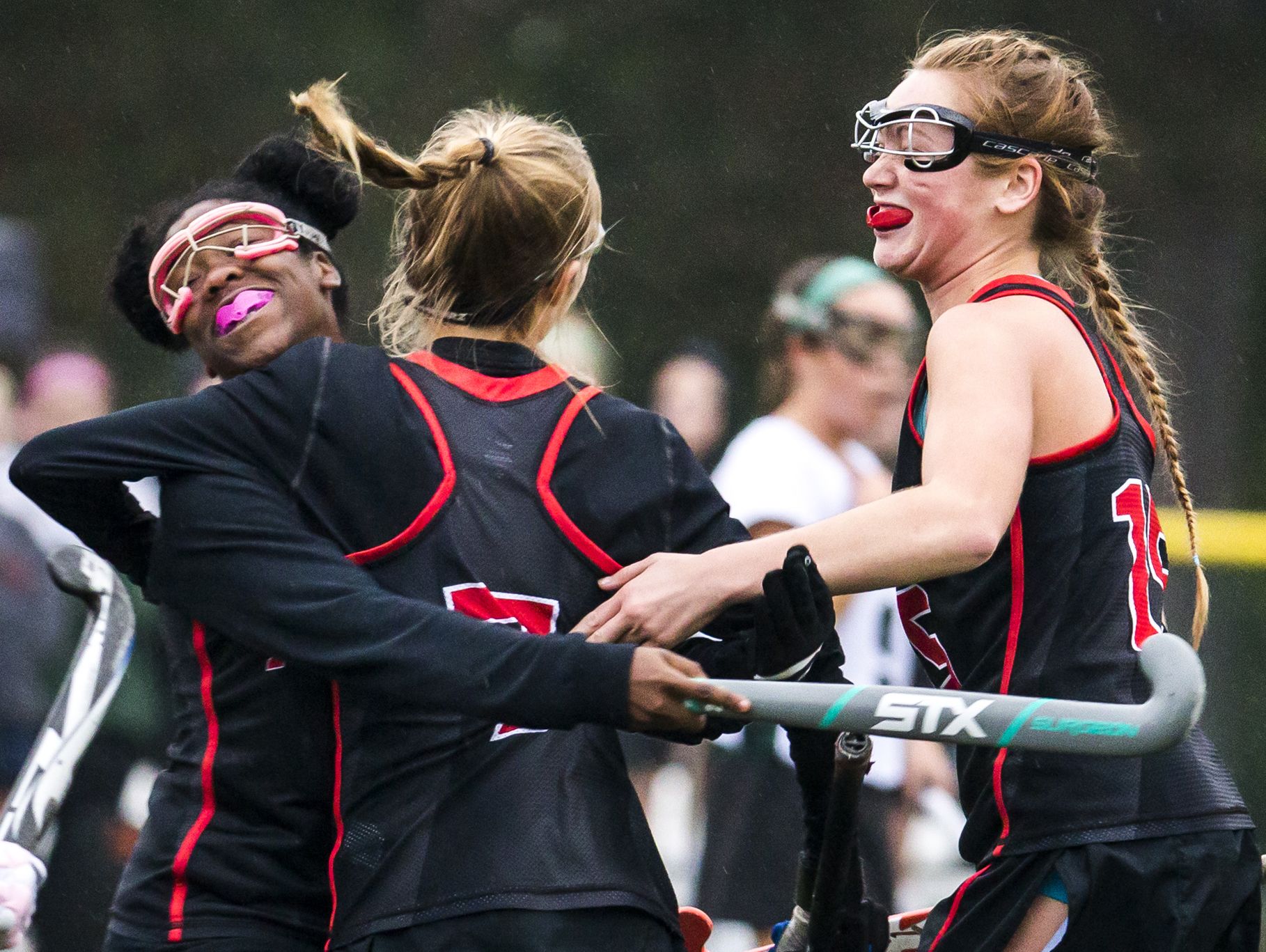 Polytech's Jennah Morris (left), Lacy Bayley (center) and Grace Stang (right) celebrate a goal in the first half of Polytech's 1-0 win over Archmere at Archmere Academy in their DIAA playoff game on Wednesday afternoon.