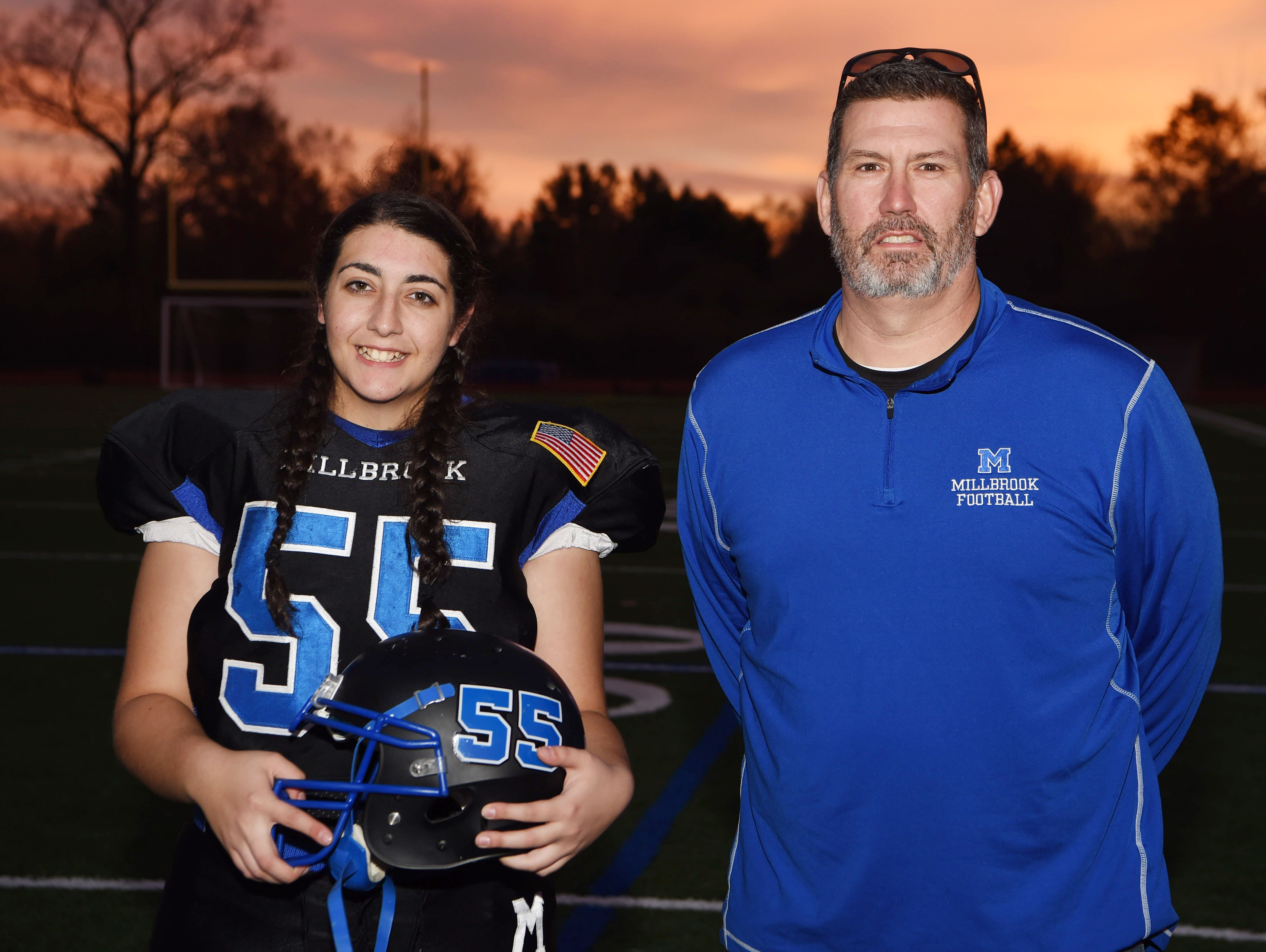 Coryne DeMattio, 15, is sophomore at Millbrook High School and plays defensive line for the football team. She is pictured here with her coach, Sean Keenan.