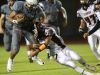 Marques Prior of Rancho Mirage High School runs for yardage in the third quarter of their CIF post-season game against Los Amigos High School at home.