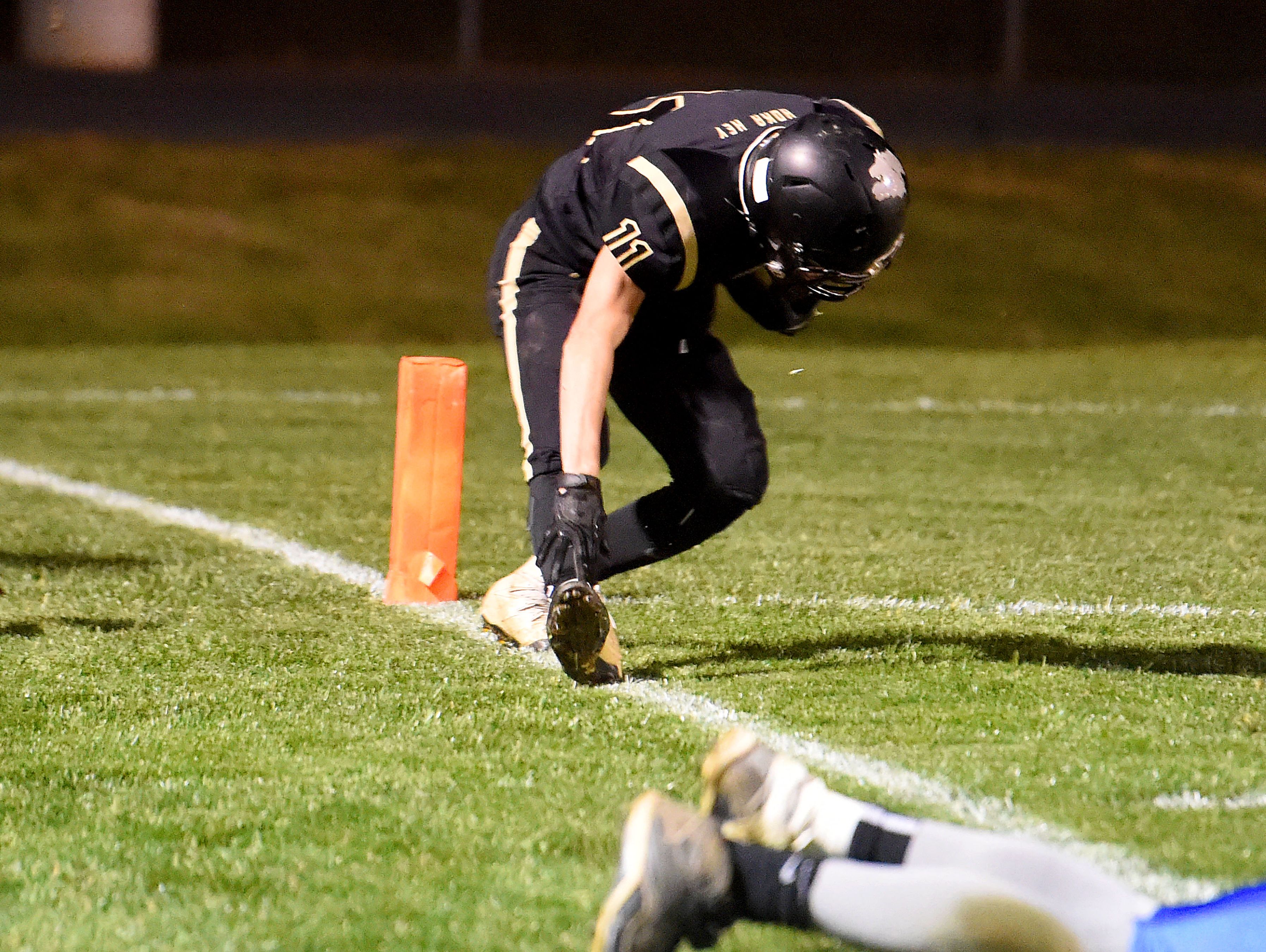 Buffalo Gap's Josh Reed spins around trying to stay in bounds but his foot just slips over the line one yard short of the goal line during a football game played in Swoope on Oct. 27, 2016.