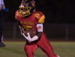 Glasgow's Tyrique Woodland (15) runs with the ball down field in their home game against St. Georges.