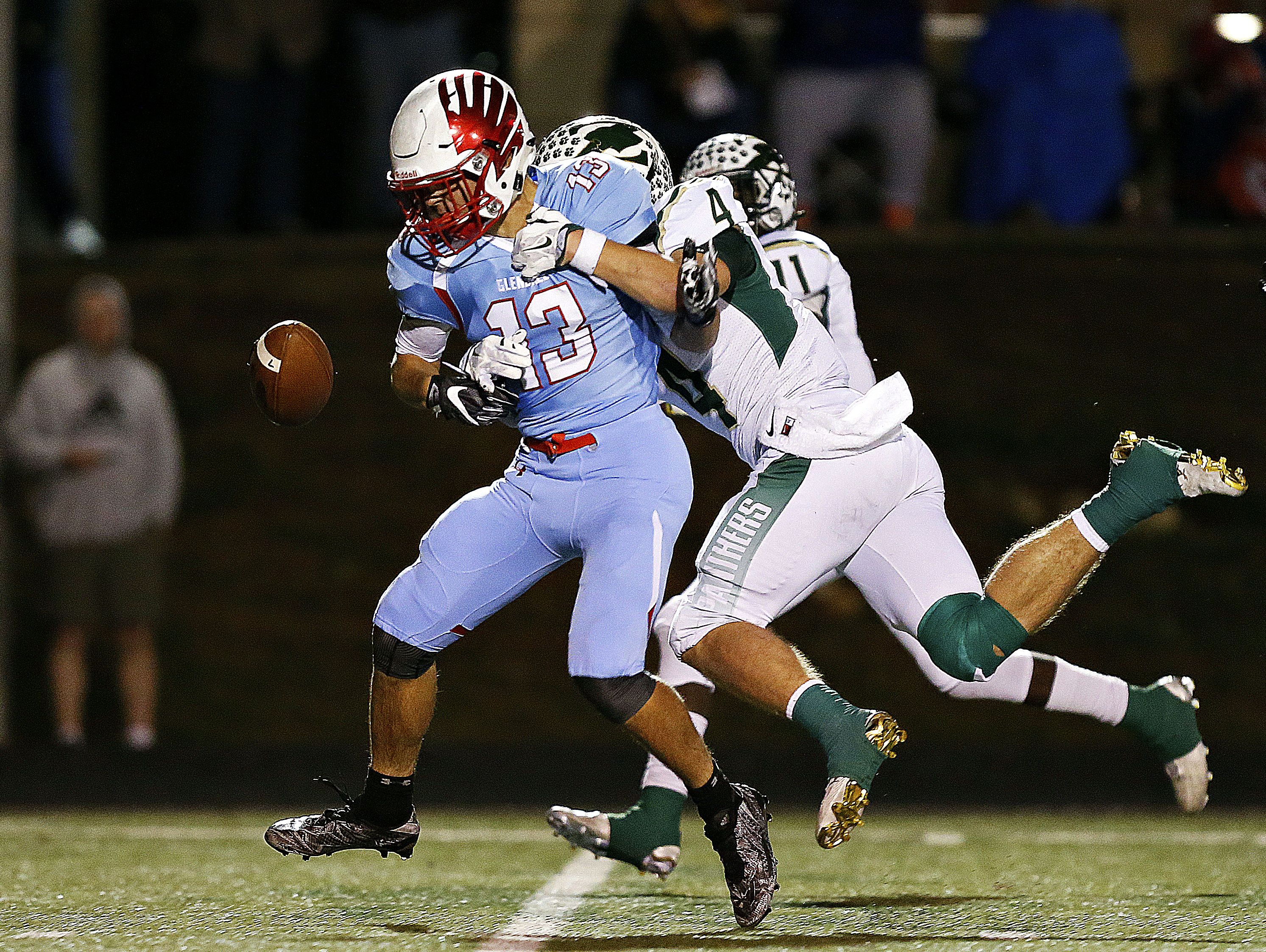 Glendale High School wide receiver Max Nichols (13) fumbles the ball after a tackle by Panthers defensive back Cade Brister (4) during first quarter action of the playoff game between Glendale High School and Ft. Zumwalt North High School held at Lowe Stadium in Springfield, Mo. on Nov. 11, 2016.