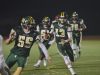 Melbourne Central Catholic quarterback Joaquin Collazo runs with a convoy of teammates during the Hustlers' win over Cardinal Mooney on Friday night.