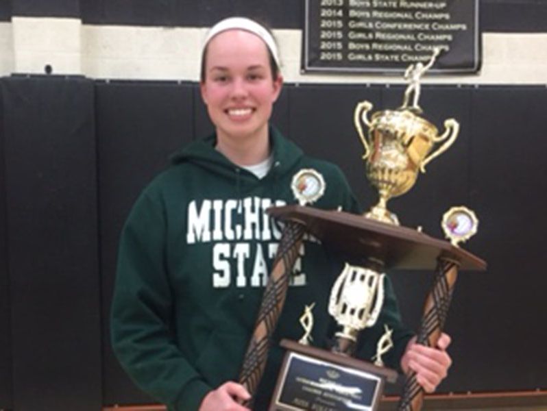 Corunna star Meredith Norris poses with her trophy after being named Michigan Miss Basketball 2016