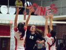 Buffalo Gap's Emily Hanger spikes the ball over Marion's Caeley Glisan, left, and Kirsten Lefler during their Group 2A state volleyball semifinal in Marion, Va., on Tuesday, Nov. 15, 2016.