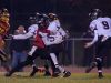 Caravel's Josiah Larkins (5) is quickly tackled by Glasgow's Tyrique Woodland (15) during the second quarter in the opening round of the DIAA Division II playoffs at Glasgow High School.