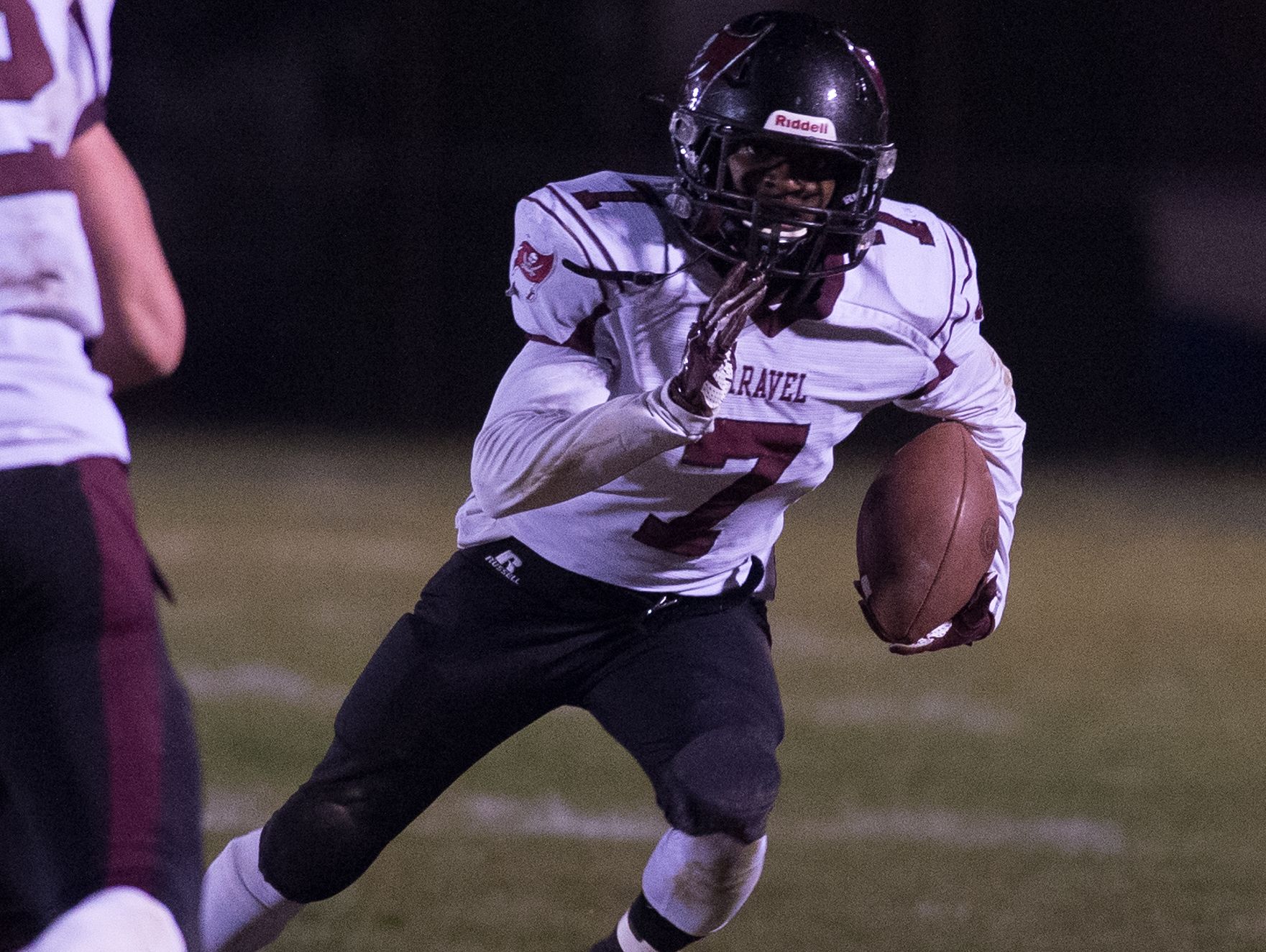 Caravel's Mandela Montgomery (7) runs the ball toward the sideline during the second quarter against Glasgow in the opening round of the DIAA Division II playoffs at Glasgow High School.