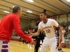 Glendale junior Monty Johal (right) low fives teammate Von Oeser (left) before Glendale's 2015-2016 season-opening home win over Carnahan.