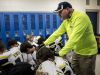 Algonac coach Scott Barnhart stands with the team as they pray in the locker room during a Division 5 semifinal football game Saturday, Nov. 19, 2016 at Harper Creek High School in Battle Creek.
