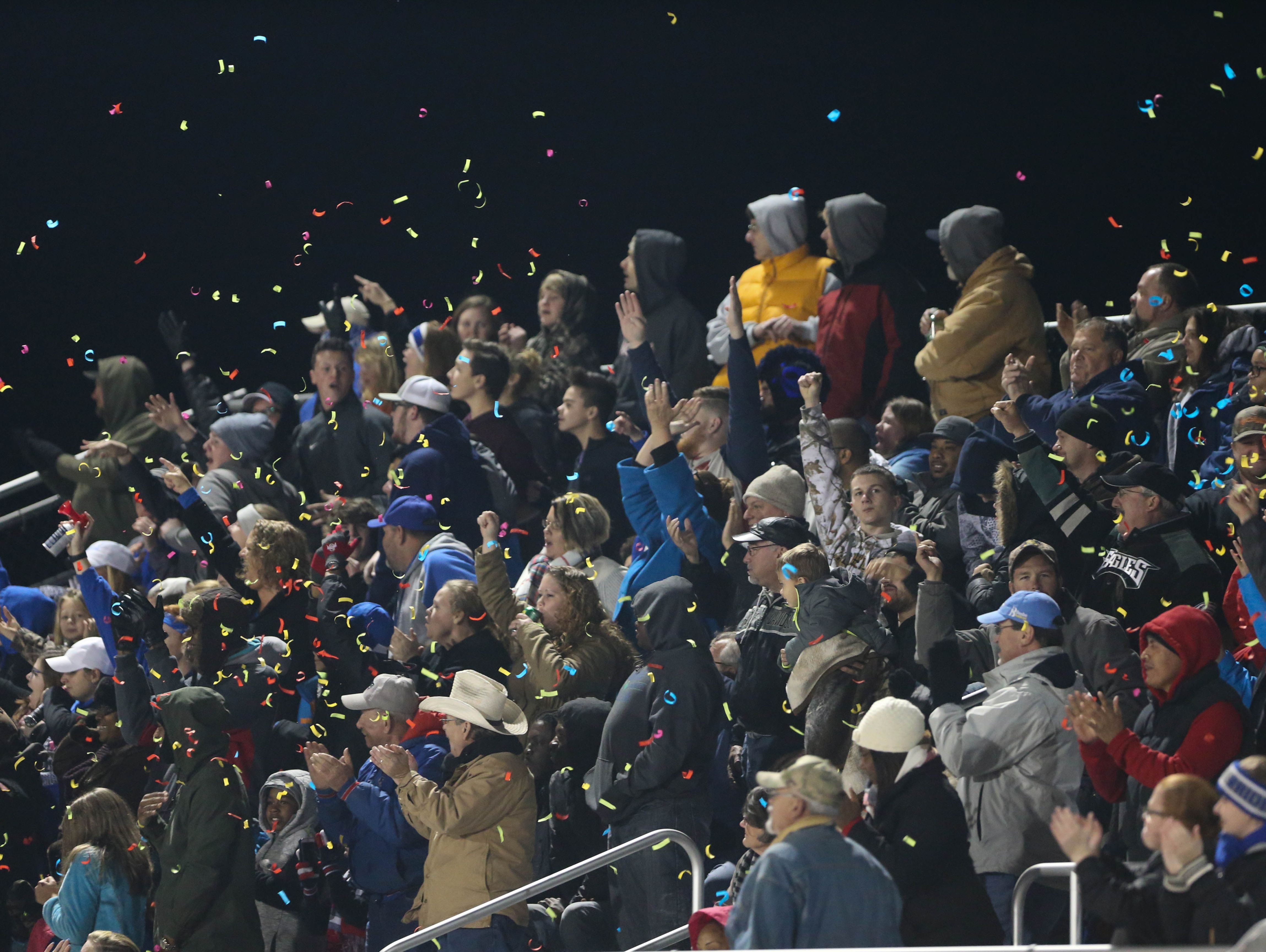 Woodbridge fan celebrate a third quarter touchdown during the Woodbridge-Caravel Division II state semifinal game at Woodbridge Friday.