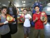 From far right, Brandun Lee, Anthony Reyes and Rommel Caballero all placed first during the 2015 Desert Showdown amateur boxing competition.