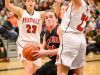 Hilton's Alyssa Juergens rebounds the ball defended by Penfield's Gabby Pancio (21) and Olivia Colombo (23) in the first half of Saturday's Class AA girls basketball championship.