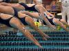 Pittsford's Molly Brennan, top center, and other swimmers take off from the blocks in the 100 yard freestyle.