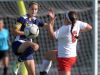 Victor's Abby Richards, left, and Penfield's Meghan Carroll challenge for the ball.