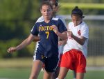 Penfield's Victoria Sabel, right, turns the ball away form Victor's Leah Post.