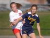 Victor's Leah Post, right, shields the ball from Penfield's Jordan Egger.