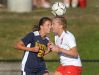 Penfield's Katie Summerson, right, and Victor's Lexi Perry challenge for a header.