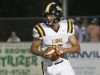 Scotts Hill’s Cody Carter (14) runs with the ball against Chester County during the Star Physical Therapy Jamboree at Chester County High School on Aug. 12. Carter threw for 257 yards this week and ran for three touchdowns as the Lions got a program-best seven wins this regular season.