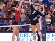 Abigail Rzucidlo of Ursuline and Sydney Fulton of DMA compete at the net as Ursuline and DMA play in the DIAA volleyball finals at UD's Bob Carpenter Center.