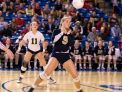 Morgan Andrews of DMA ducks a long serve as Ursuline and DMA play in the DIAA volleyball finals at UD's Bob Carpenter Center.